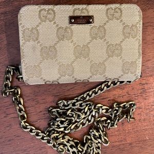 Gucci monogram canvas wallet with inside key ring. Comes with non branded chain